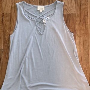 Grey flowy tank top. Fun v-neck neckline.